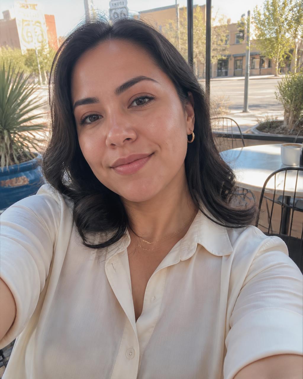 Elena, 32, on an upscale Nob Hill coffee-shop patio in Albuquerque, looking calm and refreshed.